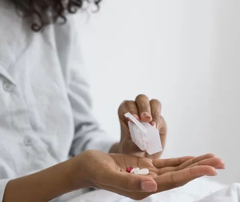 Close up woman with pill
